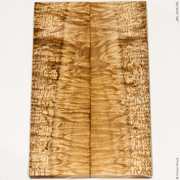 Stabilized curly gmelina wood panels